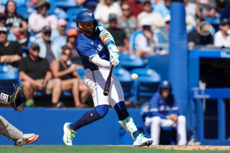 Mar 6, 2025; Dunedin, Florida, USA; Toronto Blue Jays shortstop Bo Bichette (11) hits a single for an rbi against the Boston Red Sox in the third inning during spring training at TD Ballpark. Credit: Nathan Ray Seebeck-Imagn Images