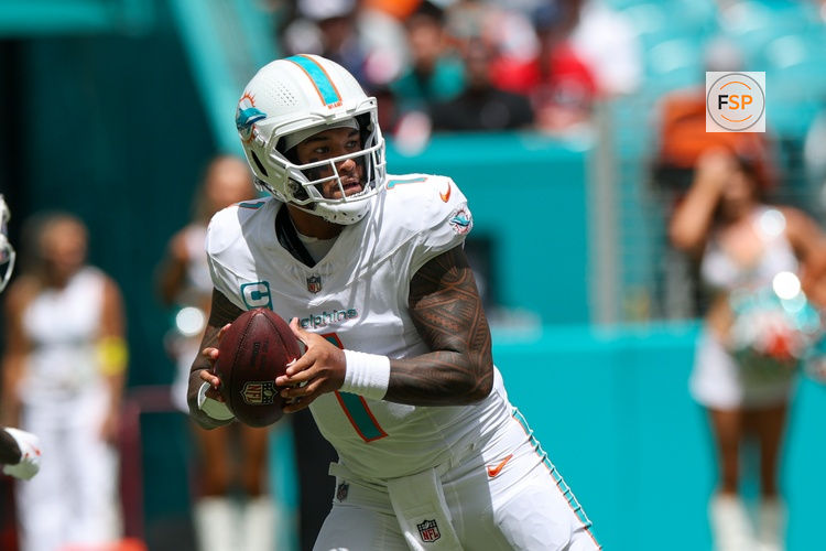 Sep 14, 2025; Miami Gardens, Florida, USA; Miami Dolphins quarterback Tua Tagovailoa (1) looks to pass against the New England Patriots in the first quarter at Hard Rock Stadium. Credit: Nathan Ray Seebeck-Imagn Images