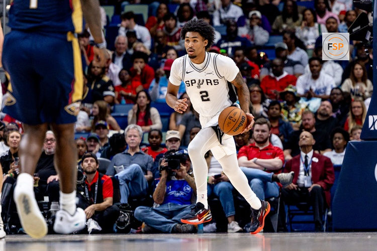 Oct 24, 2025; New Orleans, Louisiana, USA;  San Antonio Spurs guard Dylan Harper (2) brings the ball up court against the New Orleans Pelicans during the first half at Smoothie King Center. Credit: Stephen Lew-Imagn Images
