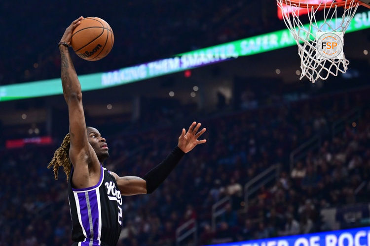 Apr 6, 2025; Cleveland, Ohio, USA; Sacramento Kings guard Keon Ellis (23) dunks during the first half against the Cleveland Cavaliers at Rocket Arena. Credit: Ken Blaze-Imagn Images