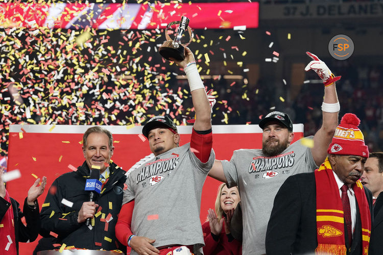 Jan 26, 2025; Kansas City, MO, USA; Kansas City Chiefs quarterback Patrick Mahomes (15) and tight end Travis Kelce (87) react after holding the  Lamar Hunt Trophy after the AFC Championship game against the Buffalo Bills at GEHA Field at Arrowhead Stadium. Credit: Denny Medley-Imagn Images