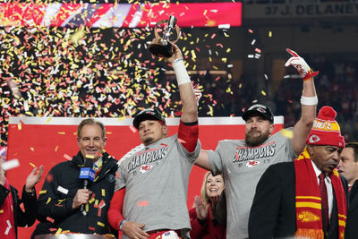 Jan 26, 2025; Kansas City, MO, USA; Kansas City Chiefs quarterback Patrick Mahomes (15) and tight end Travis Kelce (87) react after holding the  Lamar Hunt Trophy after the AFC Championship game against the Buffalo Bills at GEHA Field at Arrowhead Stadium. Mandatory Credit: Denny Medley-Imagn Images