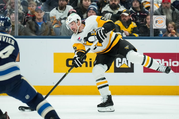 Jan 4, 2026; Columbus, Ohio, USA;  Pittsburgh Penguins defenseman Erik Karlsson (65) shoots the puck against the Columbus Blue Jackets in the second period at Nationwide Arena. Credit: Aaron Doster-Imagn Images