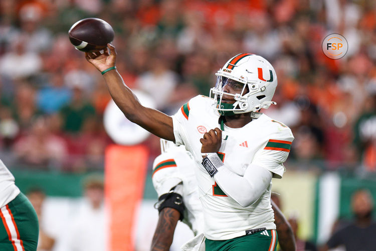 Sep 21, 2024; Tampa, Florida, USA; DUPLICATE***Miami Hurricanes quarterback Cam Ward (1) throws a pass against the South Florida Bulls in the first quarter at Raymond James Stadium. Credit: Nathan Ray Seebeck-Imagn Images