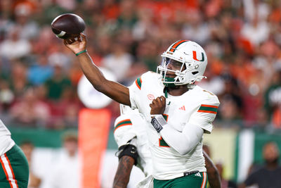 Sep 21, 2024; Tampa, Florida, USA; DUPLICATE***Miami Hurricanes quarterback Cam Ward (1) throws a pass against the South Florida Bulls in the first quarter at Raymond James Stadium. Mandatory Credit: Nathan Ray Seebeck-Imagn Images