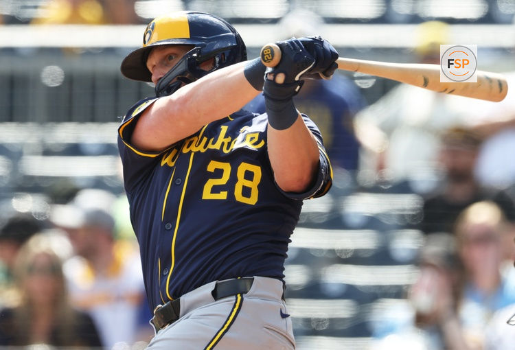 Sep 7, 2025; Pittsburgh, Pennsylvania, USA;  Milwaukee Brewers first baseman Andrew Vaughn (28) hits a double against the Pittsburgh Pirates during the fourth inning at PNC Park. Credit: Charles LeClaire-Imagn Images