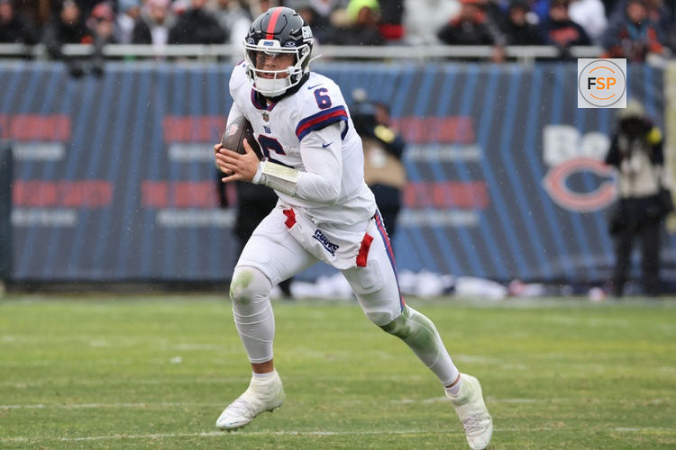 Nov 9, 2025; Chicago, Illinois, USA; New York Giants quarterback Jaxson Dart (6) rushes the ball against the Chicago Bears during the second half at Soldier Field. Credit: Mike Dinovo-Imagn Images