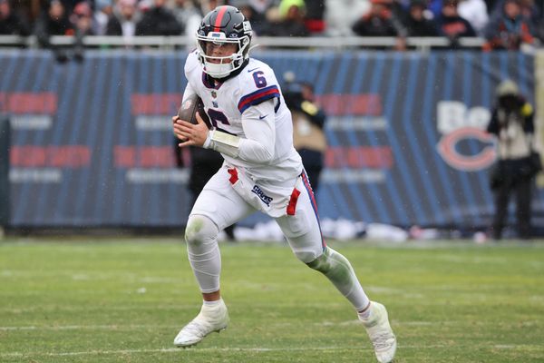 Nov 9, 2025; Chicago, Illinois, USA; New York Giants quarterback Jaxson Dart (6) rushes the ball against the Chicago Bears during the second half at Soldier Field. Mandatory Credit: Mike Dinovo-Imagn Images