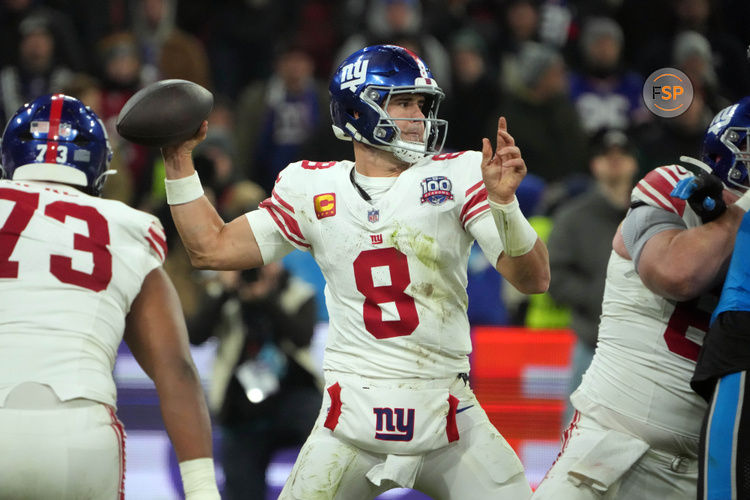 Nov 10, 2024; Munich, Germany; New York Giants quarterback Daniel Jones (8) throws the ball against the Carolina Panthers  in the second half during the 2024 NFL Munich Game at Allianz Arena. Credit: Kirby Lee-Imagn Images