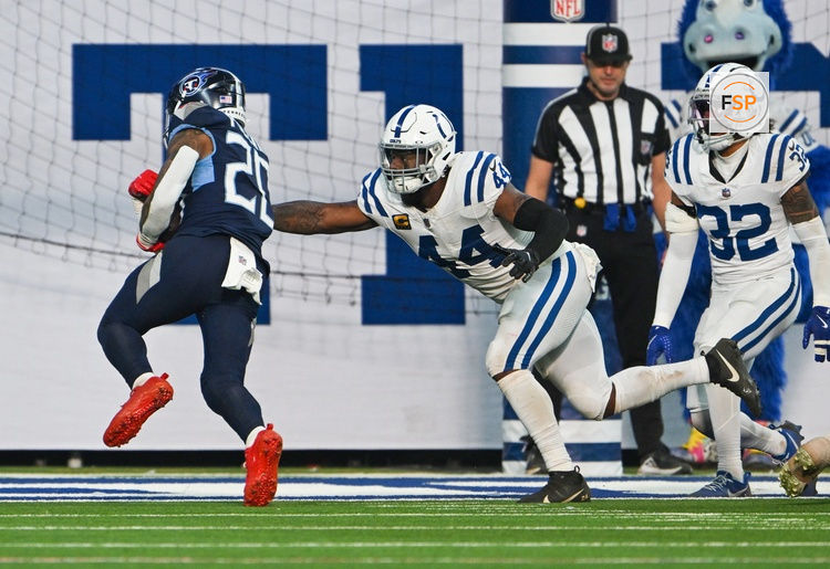 Dec 22, 2024; Indianapolis, Indiana, USA; Tennessee Titans running back Tony Pollard (20) runs past Indianapolis Colts linebacker Zaire Franklin (44) for a touchdown during the second half at Lucas Oil Stadium. Credit: Marc Lebryk-Imagn Images