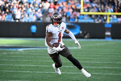 Dec 21, 2025; Charlotte, North Carolina, USA; Tampa Bay Buccaneers running back Rachaad White (1) with the ball in the third quarter at Bank of America Stadium. Mandatory Credit: Bob Donnan-Imagn Images