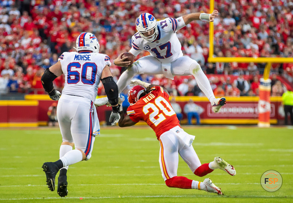 KANSAS CITY, MO - OCTOBER 16: Buffalo Bills quarterback Josh Allen (17) leaps over a Kansas City Chiefs safety Justin Reid (20) during the game between the Kansas City Chiefs and the Buffalo Bills on Sunday October 16, 2022 at Arrowhead Stadium in Kansas City, MO.  (Photo by Nick Tre. Smith/Icon Sportswire)