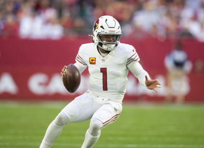 Dec 15, 2024; Glendale, Arizona, USA; Arizona Cardinals quarterback Kyler Murray (1) against the New England Patriots at State Farm Stadium. Mandatory Credit: Mark J. Rebilas-Imagn Images