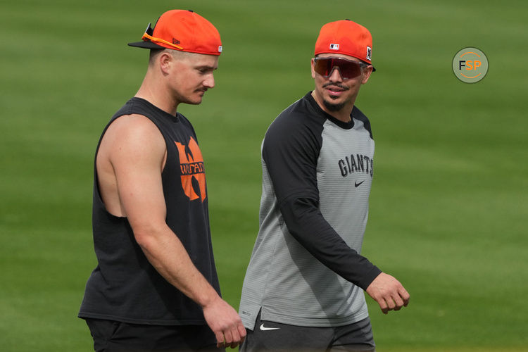 Feb 13, 2025; Scottsdale, AZ, USA; San Francisco Giants third base Matt Chapman (26) and shortstop Willy Adames (2) talk during spring training camp. Credit: Rick Scuteri-Imagn Images