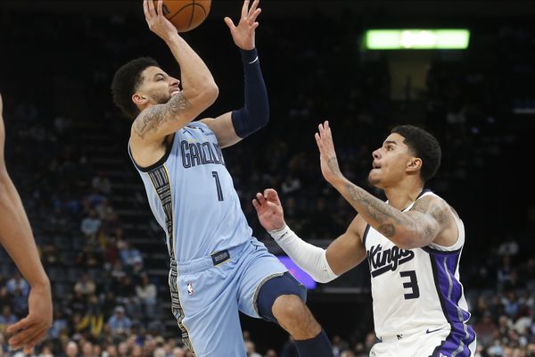 Feb 23, 2026; Memphis, Tennessee, USA; Memphis Grizzlies guard Scotty Pippen Jr. (1) shoots as Sacramento Kings guard Killian Hayes (3) defends during the fourth quarter at FedExForum. Mandatory Credit: Petre Thomas-Imagn Images