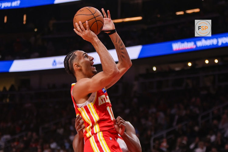 Oct 22, 2025; Atlanta, Georgia, USA; Atlanta Hawks forward Zaccharie Risacher (10) shoots against the Toronto Raptors in the second quarter at State Farm Arena. Credit: Brett Davis-Imagn Images

