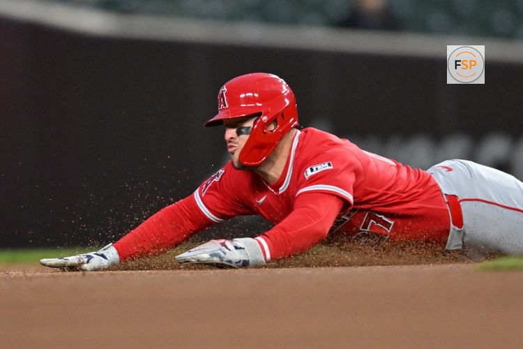 Mar 31, 2026; Chicago, Illinois, USA; Los Angeles Angels center fielder Mike Trout (27) slides to steal second base against the Chicago Cubs during the first inning at Wrigley Field. Credit: Patrick Gorski-Imagn Images