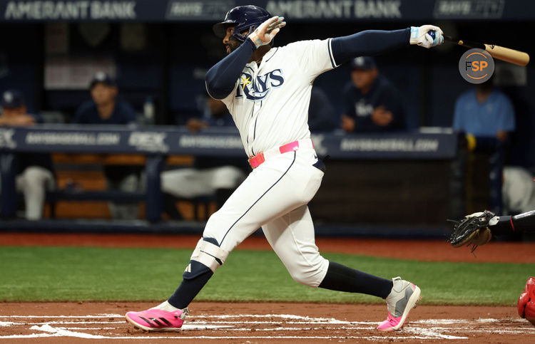 Sep 4, 2024; St. Petersburg, Florida, USA;  Tampa Bay Rays first base Yandy Diaz (2) singles against the Minnesota Twins during the first inning at Tropicana Field. Credit: Kim Klement Neitzel-Imagn Images