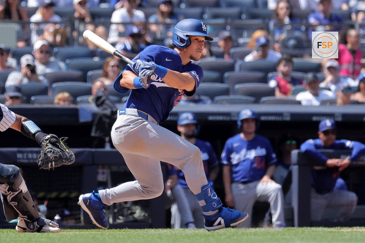 Jul 19, 2026; Bronx, New York, USA; Los Angeles Dodgers left fielder Tommy Edman (25) follows through on a two run single against the New York Yankees during the eighth inning at Yankee Stadium. Credit: Brad Penner-Imagn Images