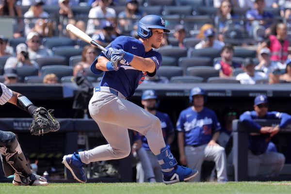 Jul 19, 2026; Bronx, New York, USA; Los Angeles Dodgers left fielder Tommy Edman (25) follows through on a two run single against the New York Yankees during the eighth inning at Yankee Stadium. Mandatory Credit: Brad Penner-Imagn Images