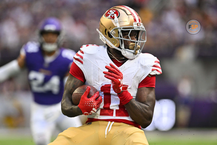 Sep 15, 2024; Minneapolis, Minnesota, USA; San Francisco 49ers wide receiver Brandon Aiyuk (11) looks for yards after the catch against the Minnesota Vikings during the first quarter U.S. Bank Stadium. Credit: Jeffrey Becker-Imagn Images