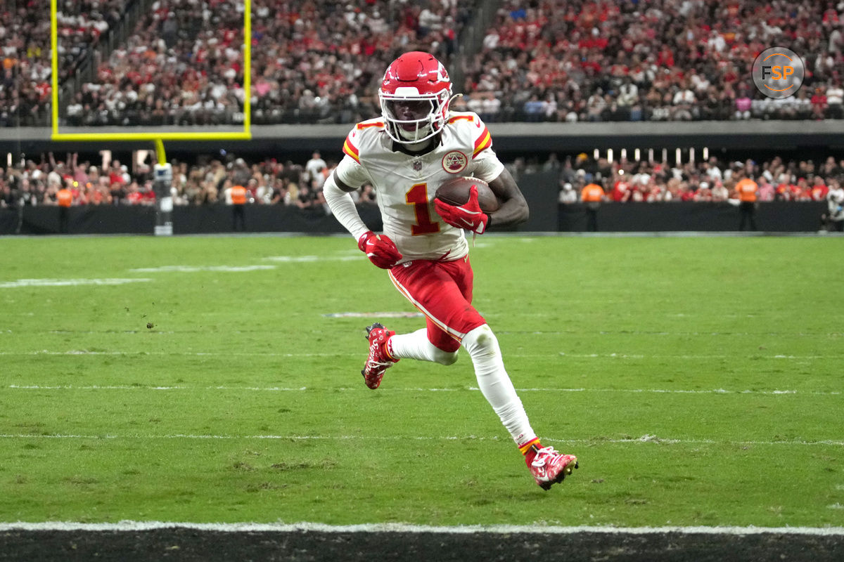 Oct 27, 2024; Paradise, Nevada, USA; Kansas City Chiefs wide receiver Xavier Worthy (1) scores on a 9-yard touchdown reception against the Las Vegas Raiders in the second half at Allegiant Stadium. Credit: Kirby Lee-Imagn Images