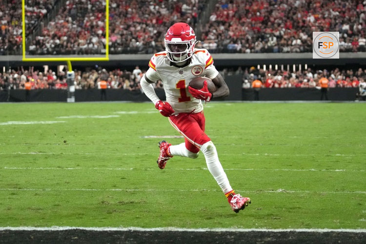 Oct 27, 2024; Paradise, Nevada, USA; Kansas City Chiefs wide receiver Xavier Worthy (1) scores on a 9-yard touchdown reception against the Las Vegas Raiders in the second half at Allegiant Stadium. Credit: Kirby Lee-Imagn Images