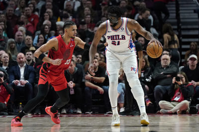 Dec 30, 2024; Portland, Oregon, USA; Philadelphia 76ers center Joel Embiid (21) handles the ball against Portland Trail Blazers forward Toumani Camara (33) during the second half at Moda Center. Mandatory Credit: Soobum Im-Imagn Images