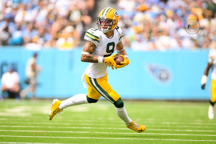 Sep 22, 2024; Nashville, Tennessee, USA;  Green Bay Packers wide receiver Christian Watson (9) runs the ball after a made catch against the Tennessee Titans during the first half at Nissan Stadium. Credit: Steve Roberts-Imagn Images