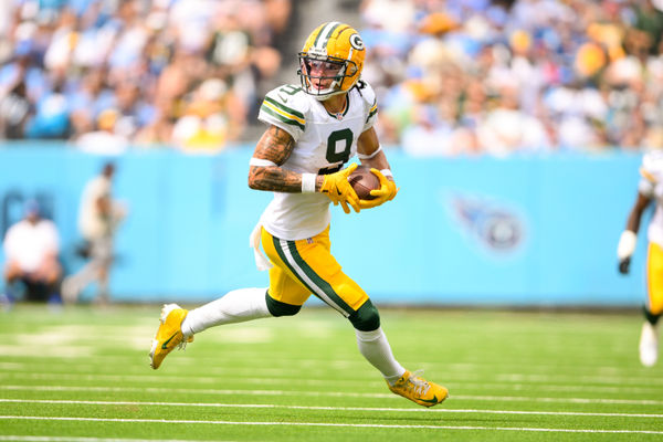 Sep 22, 2024; Nashville, Tennessee, USA;  Green Bay Packers wide receiver Christian Watson (9) runs the ball after a made catch against the Tennessee Titans during the first half at Nissan Stadium. Mandatory Credit: Steve Roberts-Imagn Images