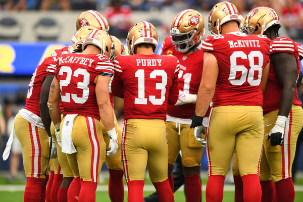 INGLEWOOD, CA - SEPTEMBER 17: San Francisco 49ers quarterback Brock Purdy (13), San Francisco 49ers running back Christian McCaffrey (23) and San Francisco 49ers offensive lineman Colton McKivitz (68) in the huddle during the NFL game between the San Francisco 49ers and the Los Angeles Rams on September 17, 2023, at SoFi Stadium in Inglewood, CA. (Photo by Brian Rothmuller/Icon Sportswire)