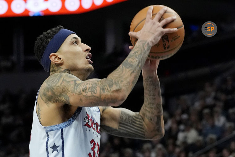 Feb 1, 2025; Minneapolis, Minnesota, USA; Washington Wizards forward Kyle Kuzma (33) goes to the basket against the Minnesota Timberwolves in the second quarter at Target Center. Credit: Bruce Kluckhohn-Imagn Images