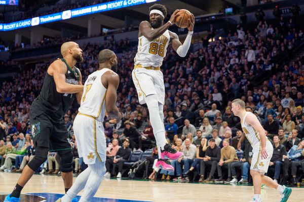 Nov 29, 2025; Minneapolis, Minnesota, USA; Boston Celtics center Neemias Queta (88) rebounds a Minnesota Timberwolves shot in the fourth quarter at Target Center. Mandatory Credit: Matt Blewett-Imagn Images