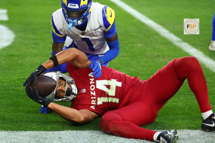 Dec 7, 2025; Glendale, Arizona, USA; Arizona Cardinals wide receiver Michael Wilson (14) makes a touchdown catch against Los Angeles Rams cornerback Emmanuel Forbes Jr. (1) during the second half at State Farm Stadium. Credit: Mark J. Rebilas-Imagn Images