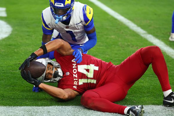 Dec 7, 2025; Glendale, Arizona, USA; Arizona Cardinals wide receiver Michael Wilson (14) makes a touchdown catch against Los Angeles Rams cornerback Emmanuel Forbes Jr. (1) during the second half at State Farm Stadium. Mandatory Credit: Mark J. Rebilas-Imagn Images