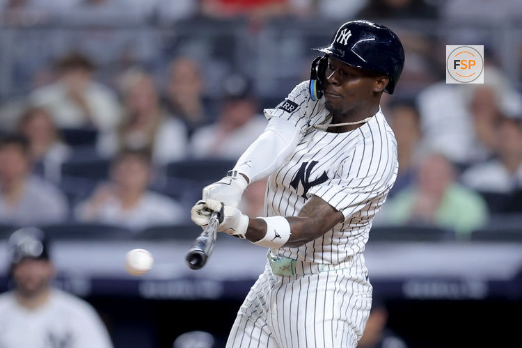 Jul 10, 2025; Bronx, New York, USA; New York Yankees second baseman Jazz Chisholm Jr. (13) hits a single against the Seattle Mariners during the eighth inning at Yankee Stadium. Credit: Brad Penner-Imagn Images