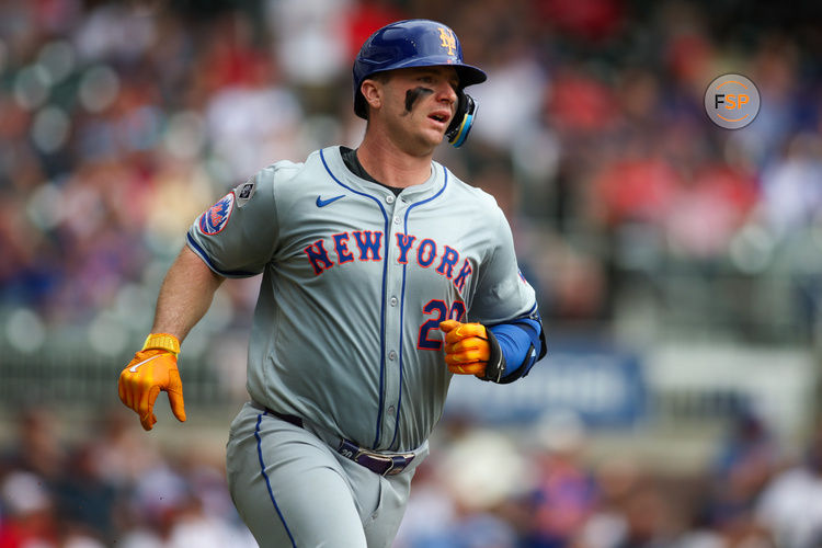 Sep 30, 2024; Atlanta, Georgia, USA; New York Mets first baseman Pete Alonso (20) hits a single against the Atlanta Braves in the fifth inning at Truist Park. Credit: Brett Davis-Imagn Images