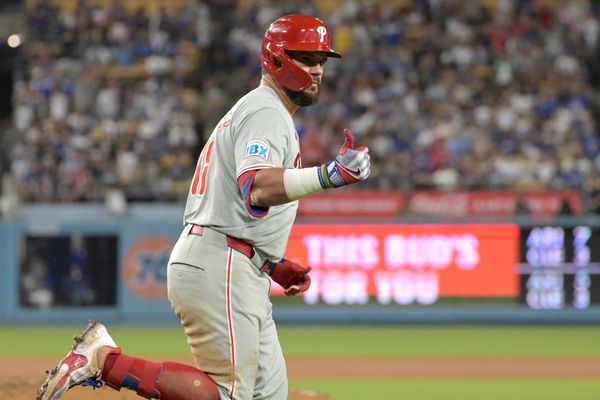 Aug 7, 2024; Los Angeles, California, USA;  Philadelphia Phillies designated hitter Kyle Schwarber (12) rounds the bases after a three-run home run in the sixth inning against the Los Angeles Dodgers at Dodger Stadium. Mandatory Credit: Jayne Kamin-Oncea-USA TODAY Sports