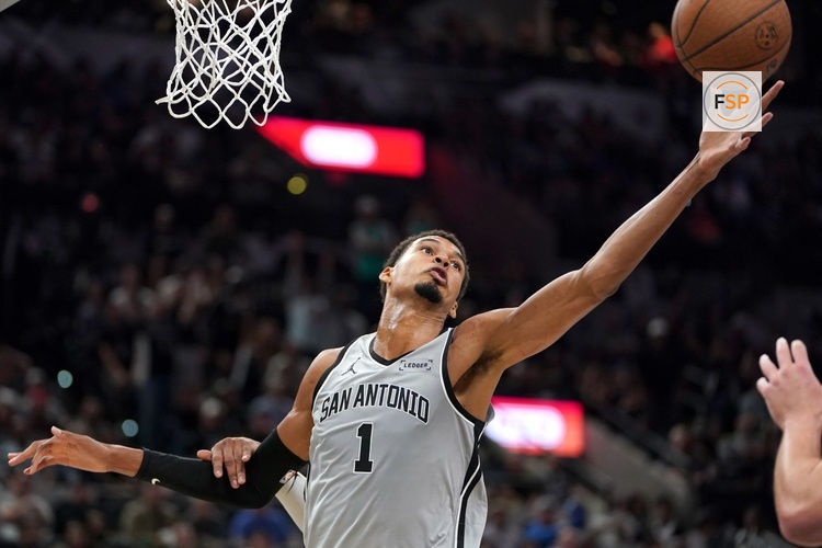Nov 7, 2025; San Antonio, Texas, USA; San Antonio Spurs forward Victor Wembanyama (1) rebounds against the Houston Rockets during the second half at Frost Bank Center. Credit: Dustin Safranek-Imagn Images