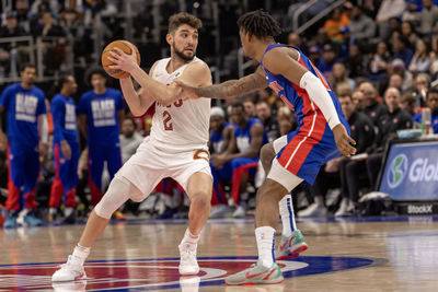 Feb 5, 2025; Detroit, Michigan, USA; Detroit Pistons forward Ronald Holland II (00) defends against Cleveland Cavaliers guard Ty Jerome (2) during the second half at Little Caesars Arena. Mandatory Credit: David Reginek-Imagn Images