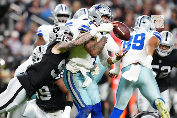 Nov 17, 2025; Paradise, Nevada, USA; Las Vegas Raiders defensive end Maxx Crosby (98) forces a fumble by Dallas Cowboys quarterback Dak Prescott (4) during the first half at Allegiant Stadium. Credit: Stephen R. Sylvanie-Imagn Images