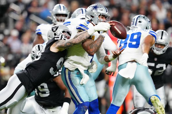 Nov 17, 2025; Paradise, Nevada, USA; Las Vegas Raiders defensive end Maxx Crosby (98) forces a fumble by Dallas Cowboys quarterback Dak Prescott (4) during the first half at Allegiant Stadium. Mandatory Credit: Stephen R. Sylvanie-Imagn Images