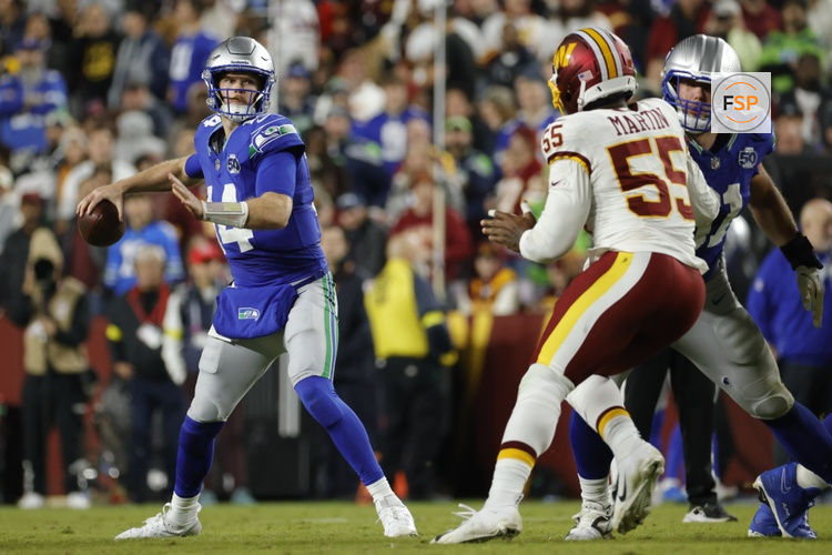 Nov 2, 2025; Landover, Maryland, USA; Seattle Seahawks quarterback Sam Darnold (14) looks to pass pressured by Washington Commanders defensive end Jacob Martin (55) during the second half at Northwest Stadium. Credit: Amber Searls-Imagn Images
