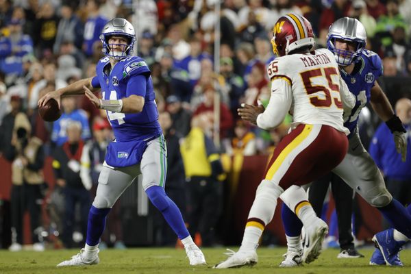 Nov 2, 2025; Landover, Maryland, USA; Seattle Seahawks quarterback Sam Darnold (14) looks to pass pressured by Washington Commanders defensive end Jacob Martin (55) during the second half at Northwest Stadium. Mandatory Credit: Amber Searls-Imagn Images