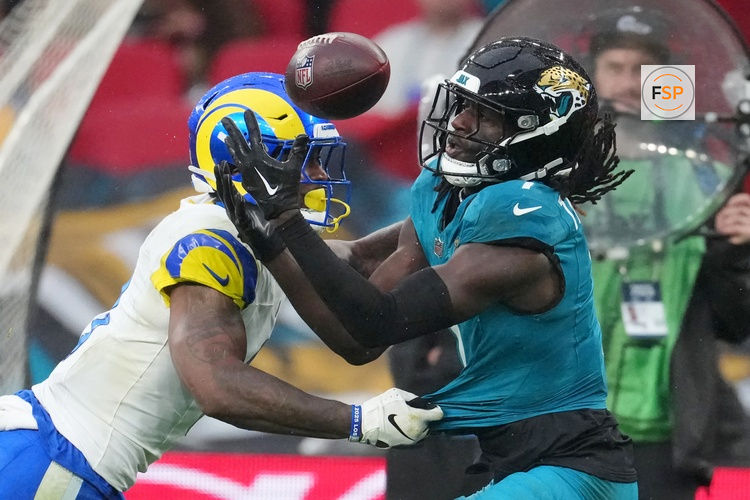 Oct 19, 2025; London, United Kingdom; Los Angeles Rams safety Kam Curl (3) breaks up a pass intended for Jacksonville Jaguars wide receiver Brian Thomas Jr. (7) during the second half of an NFL International Series game at Wembley Stadium. Credit: Kirby Lee-Imagn Images