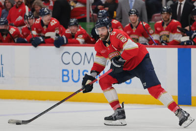 Mar 3, 2025; Sunrise, Florida, USA; Florida Panthers defenseman Aaron Ekblad (5) moves the puck against the Tampa Bay Lightning during the second period at Amerant Bank Arena. Mandatory Credit: Sam Navarro-Imagn Images