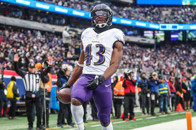 Dec 15, 2024; East Rutherford, New Jersey, USA; Baltimore Ravens running back Justice Hill (43) scores a touchdown reception during the second half against the New York Giants at MetLife Stadium. Mandatory Credit: Vincent Carchietta-Imagn Images