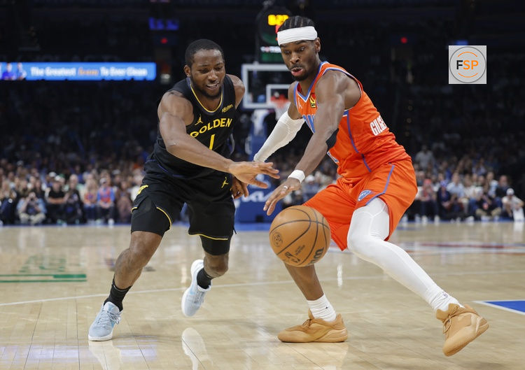 Nov 11, 2025; Oklahoma City, Oklahoma, USA; Golden State Warriors forward Jonathan Kuminga (1) and Oklahoma City Thunder guard Shai Gilgeous-Alexander (2) reach for a loose ball during the second half at Paycom Center. Credit: Alonzo Adams-Imagn Images