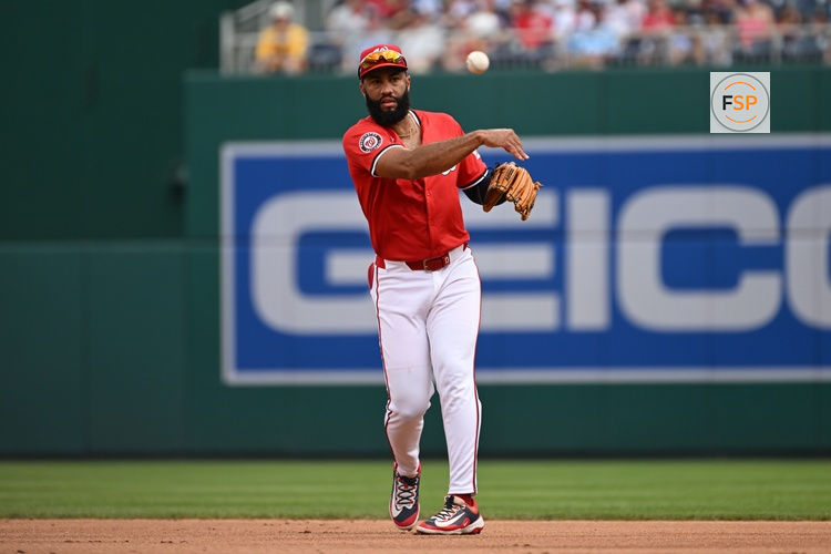 Jul 6, 2025; Washington, District of Columbia, USA; Washington Nationals third baseman Amed Rosario (13) attempts a throw to first base against the Boston Red Sox during the first inning at Nationals Park. Credit: Rafael Suanes-Imagn Images