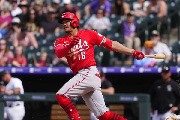 Apr 27, 2025; Denver, Colorado, USA; Cincinnati Reds third baseman Noelvi Marte (16) hits a RBI single in the ninth inning against the Colorado Rockies at Coors Field. Mandatory Credit: Ron Chenoy-Imagn Images